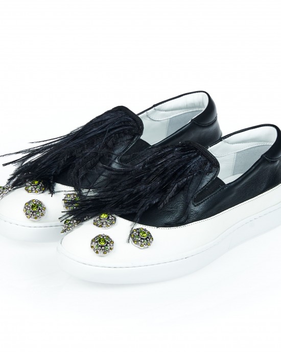 Round Toe Two-tone Slip On With Jewel Appliqué On The Tip. Feather Insert On Contrasting Tongue. Rubber Sole.