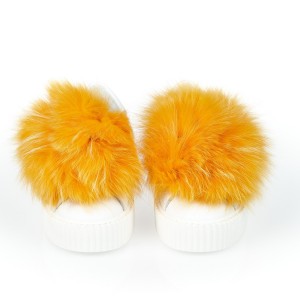 Sneaker With Real Fur Pom Poms On The Front In Contrasting Color. Thick Sole In The Same Color With A Striped Pattern.