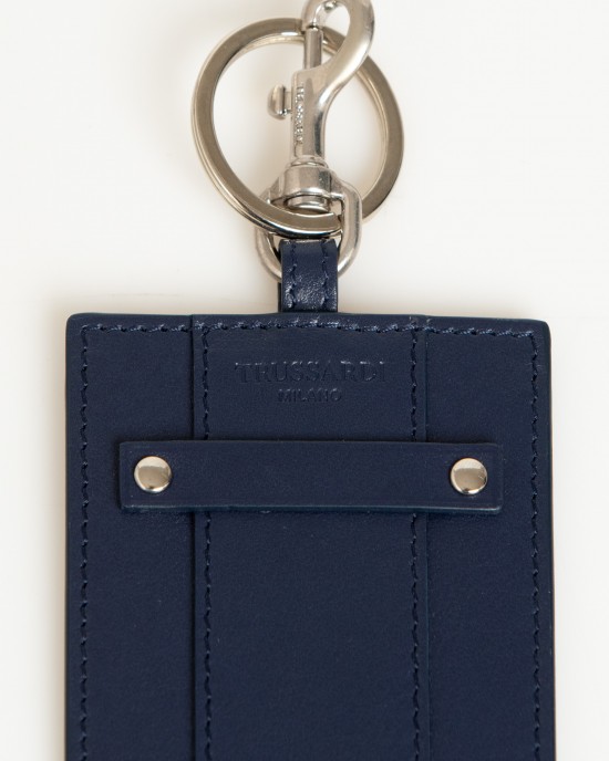 Badge Holder In Soft Leather. The Solid Colour With Hammered Detailing. Insert On The Front With Small Shiny Studs On The Sides And Debossed Brand Lettering. Shiny Key Ring With Snap Hook. Dimensions: 11 X 7 X 0.3