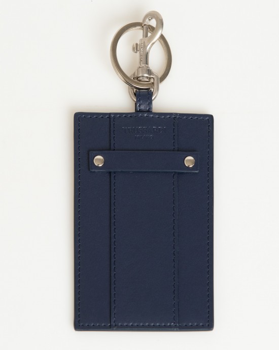 Badge Holder In Soft Leather. The Solid Colour With Hammered Detailing. Insert On The Front With Small Shiny Studs On The Sides And Debossed Brand Lettering. Shiny Key Ring With Snap Hook. Dimensions: 11 X 7 X 0.3