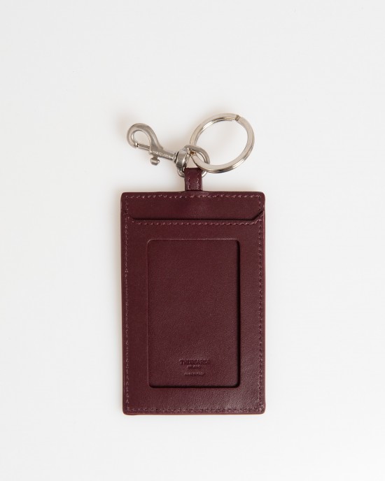 Badge Holder In Soft Leather. The Solid Colour With Hammered Detailing. Insert On The Front With Small Shiny Studs On The Sides And Debossed Brand Lettering. Shiny Key Ring With Snap Hook. Dimensions: 11 X 7 X 0.3