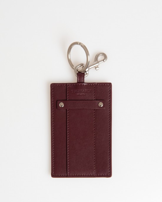 Badge Holder In Soft Leather. The Solid Colour With Hammered Detailing. Insert On The Front With Small Shiny Studs On The Sides And Debossed Brand Lettering. Shiny Key Ring With Snap Hook. Dimensions: 11 X 7 X 0.3